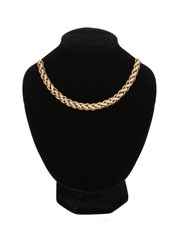 beautiful golden necklace on mannequin isolated on white