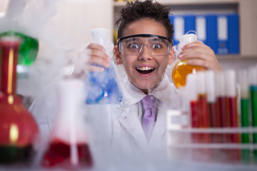 funny scientist boy working in a laboratory