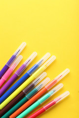 Fototapeta premium Felt-tip pens on a yellow background