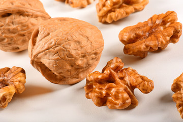 Walnuts spread on white background