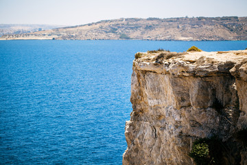 Rocks with caves and clear turquoise water