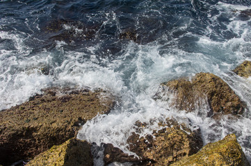 Waves breaking on the rocks.