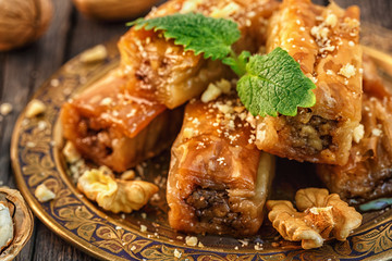 Traditional arabic dessert Baklava with honey and walnuts.