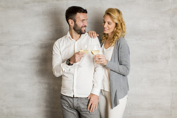 Young couple toasting with white wine
