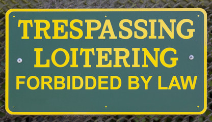 Misspelled TRESPASSING LOITERING sign. "FORBIDDED"