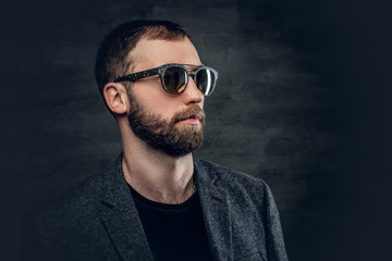Bearded male in sunglasses.