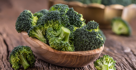Broccoli.Raw fresh broccoli on old wooden table.
