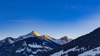alpenglow in snowy mountain landscape