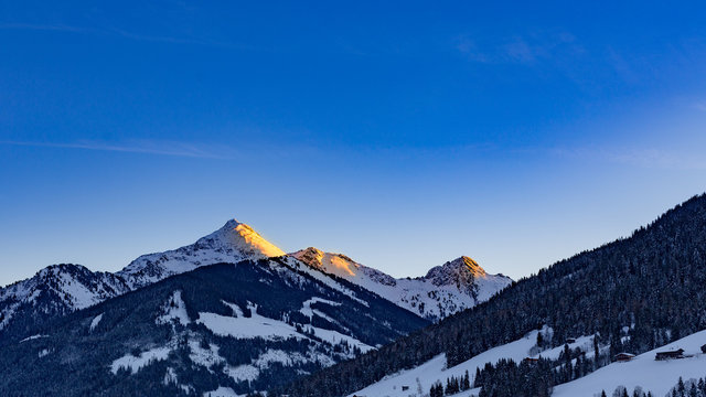 alpenglow in snowy mountain landscape