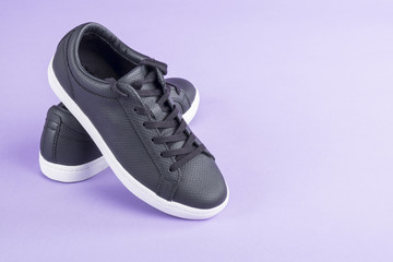 Causal Black Leather Shoes on Purple Background