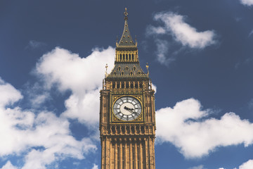 Fototapeta na wymiar Big Ben clock tower in London on sunny summer day with blue sky and white clouds