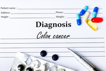 Colon cancer - diagnosis written on a white piece of paper  