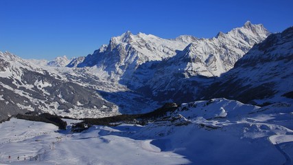 Fototapeta na wymiar Grindelwald in winter and ski slopes