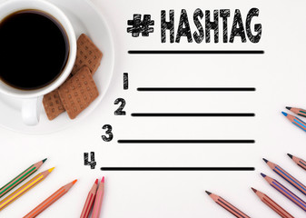 Hashtag blank list. White desk with a pencil and a cup of coffee.