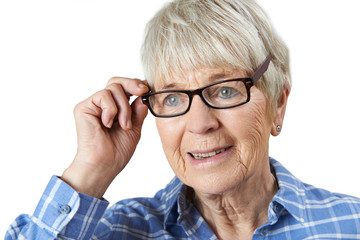 Senior Woman Trying On New Glasses