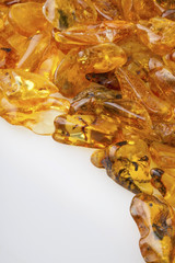 Amber stones from Baltic Sea, Lithuania, on a white background. 