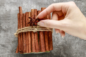 How to make candle decorated with cinnamon sticks