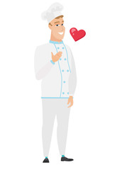 Caucasian chef cook holding hand on his chest.