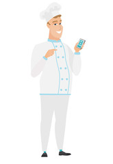 Caucasian chef cook holding a mobile phone.