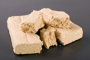 peanut halva on a dark background closeup