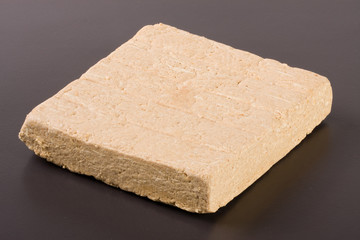 peanut halva on a dark background closeup