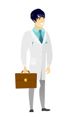 Obraz premium Asian doctor holding briefcase.