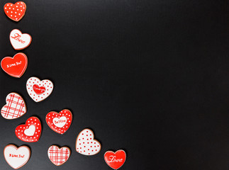 Beautiful gingerbread heart on a black background. Postcard for Valentine's day, March 8, mother's day or Wedding. Free space for text