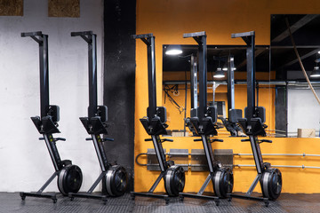 Naklejka premium Rowing machines for cross-fit training at the gym