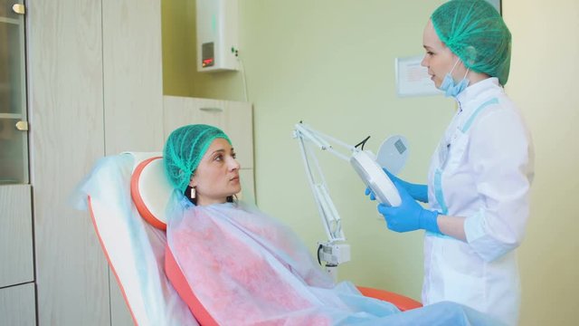 Cosmetology doctor female reviewing of her pation in medical clinic