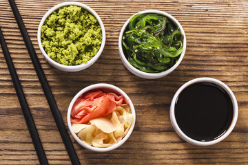 japanese wasabi, soy sauce, pickled ginger and chopsticks