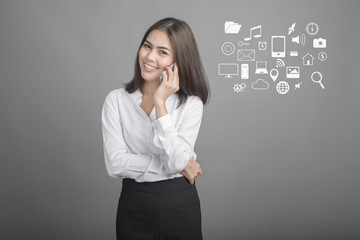 Beautiful business Woman using smartphone on grey background