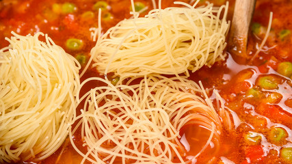 Cooking Minestrone Soup On Kitchen Table