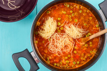 Cooking Minestrone Soup On Kitchen Table