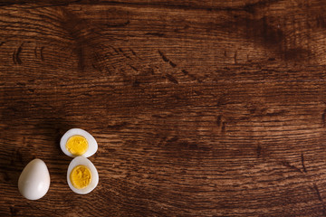 Quail eggs. Boiled sliced food. Natural organic eco eggs. Wooden rustic background.