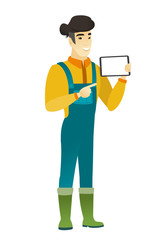 Smiling farmer holding tablet computer.