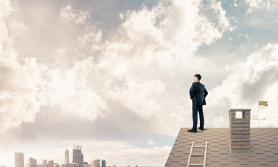 Mister boss on brick roof with arms akimbo. Mixed media