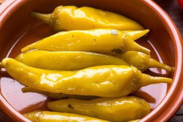 Pickled hot chili peppers on bowl