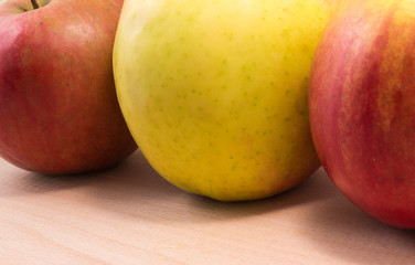 Fototapeta na wymiar apples on a wooden background