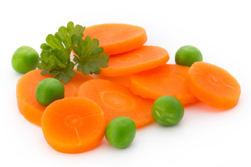 Carrot slice, green peas, isolated on white.