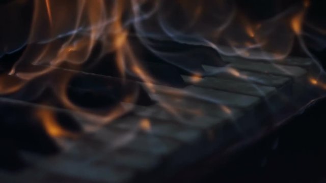 The fire is burning keys of a piano
