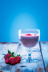 Strawberry smoothie with fresh strawberry slices