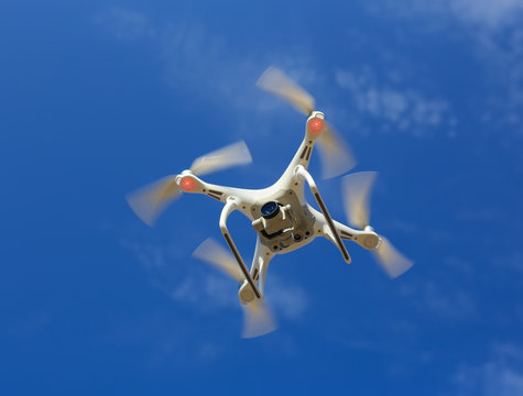 flying drone in blue sky