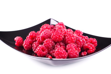 Tasty raspberries on a plate