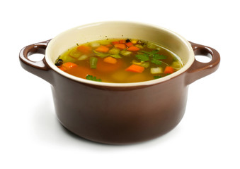 Fresh vegetable soup in pan on white background