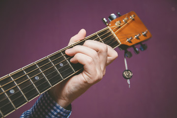 Close up of guitarist hand playing guitar