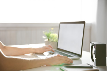 Woman working on computer at home