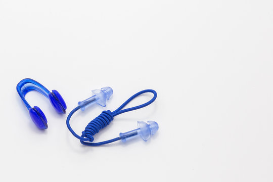 Nose clip and ear plugs for swimming pool on white background