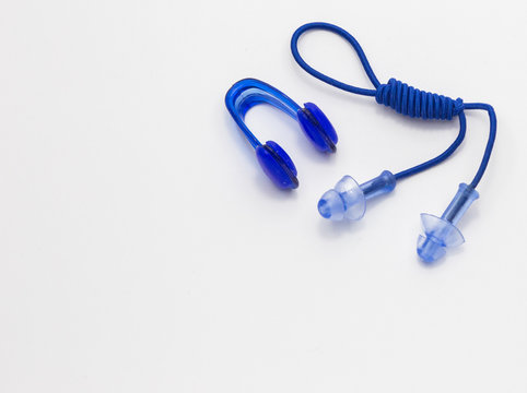 Nose clip and ear plugs for swimming pool on white background