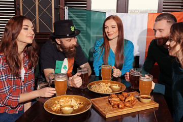 People celebrating Saint Patrick's Day in pub