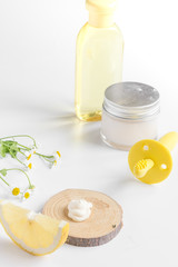 natural organic cosmetics with herbs for baby on white background